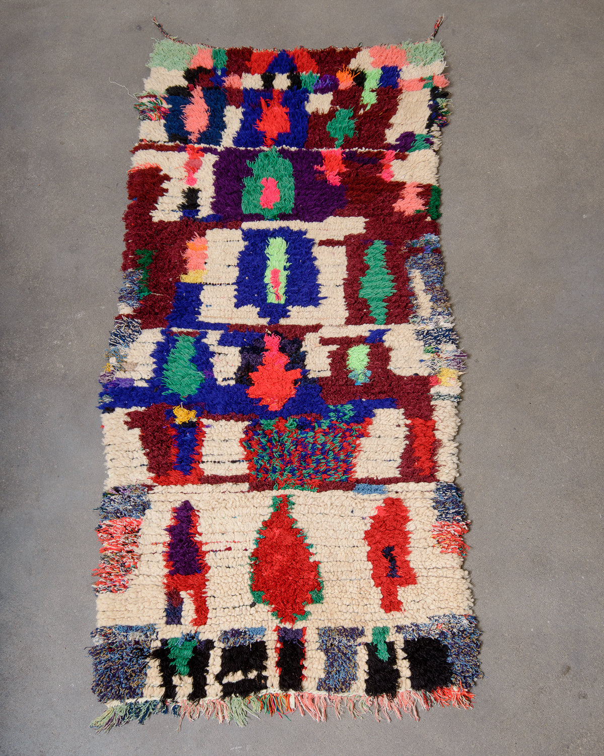 Modern designer vintage handcrafted Berber rug from Morocco. Boucherouite runner rug with beautiful colors and patterns.